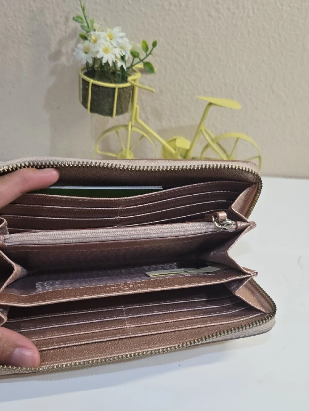 kate spade metallic rose gold zip-around continental wallet